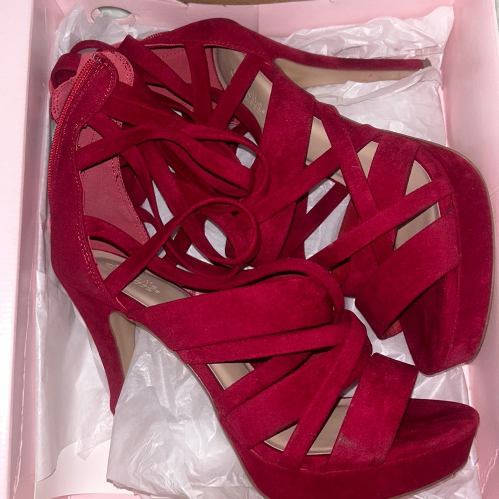Tall Red suede heels small Knick on the heel see picture #3. (Barely noticeable)